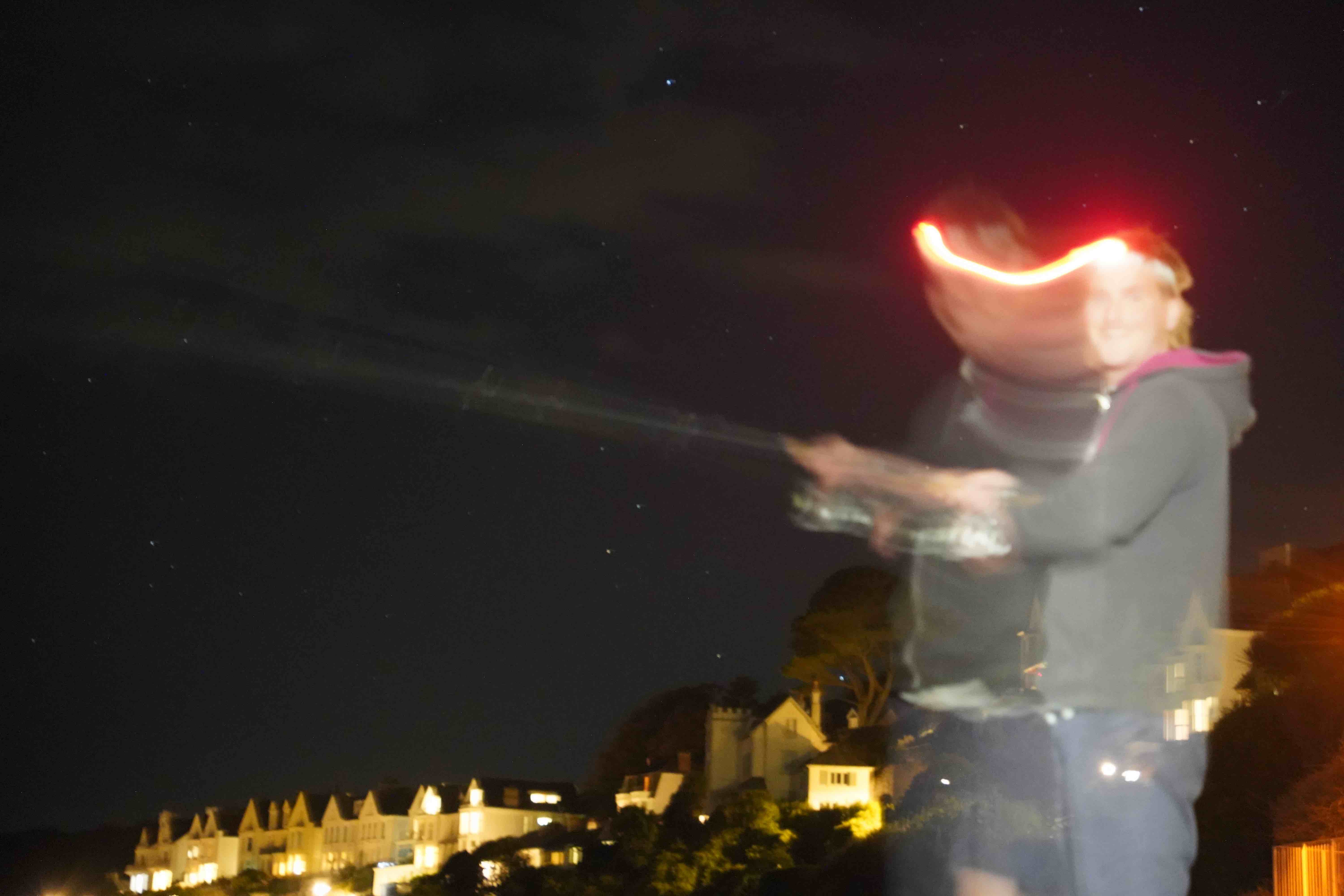 squid fishing at night in bending light